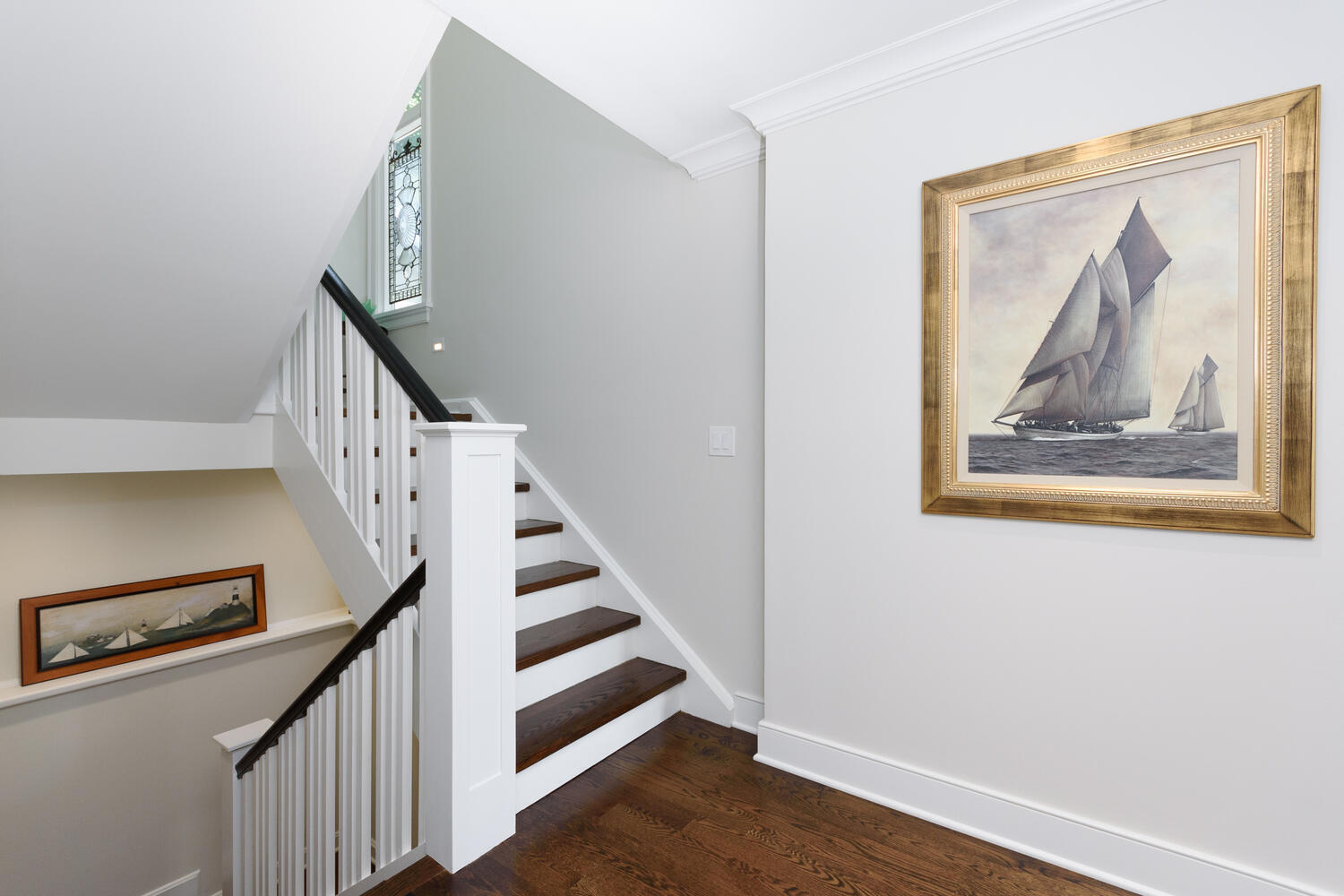 79 Rings End Road Darien, CT 06820 - Photo 22 of 42 a view of staircase with wooden floor and white walls