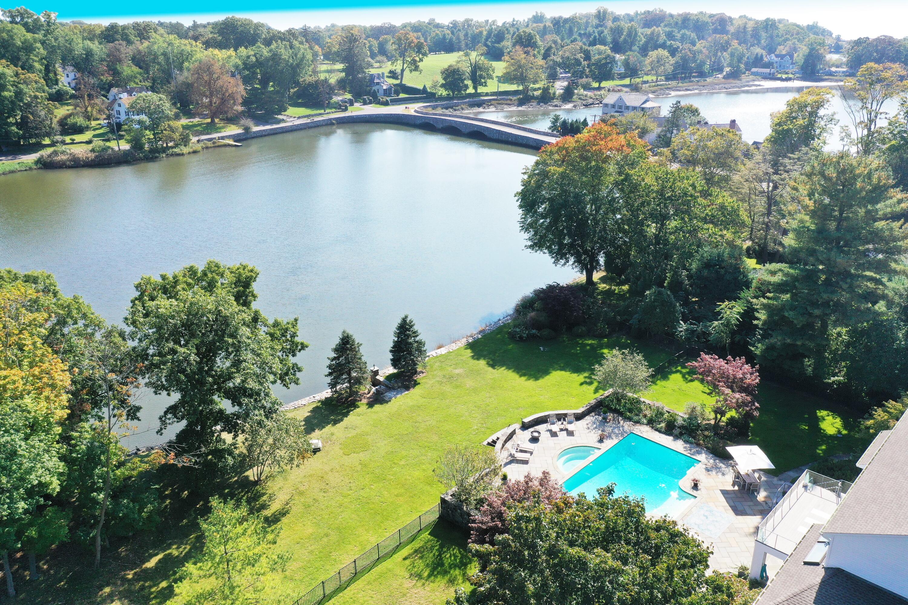 79 Rings End Road Darien, CT 06820 - Photo 3 of 42 an aerial view of residential houses with outdoor space and lake view