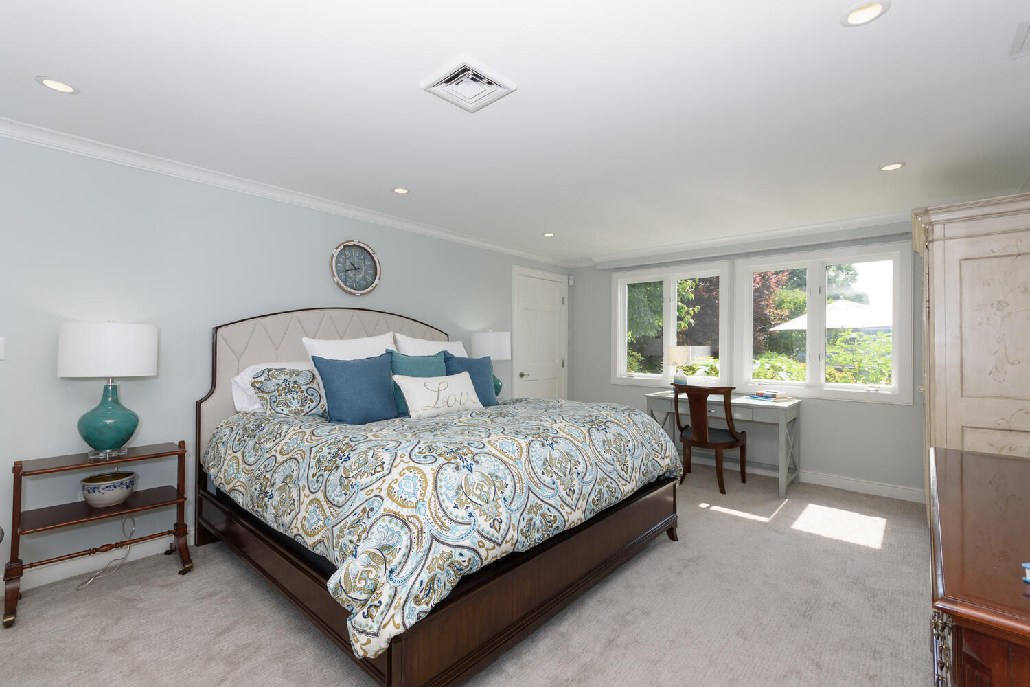 79 Rings End Road Darien, CT 06820 - Photo 32 of 42 a bedroom with a bed lamp and window