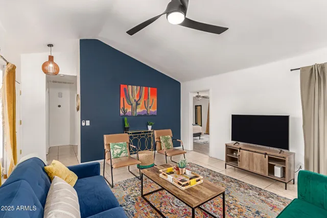 a living room with furniture and a flat screen tv