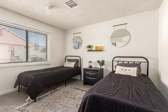 a bedroom with bed and window