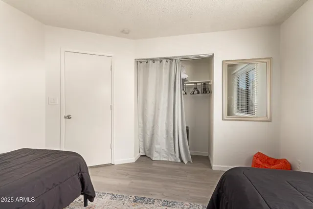 a bedroom with a bed and a window