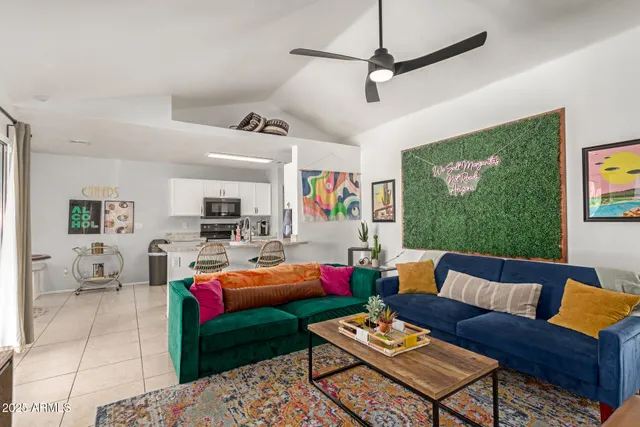 a living room with furniture a air conditioner and a window