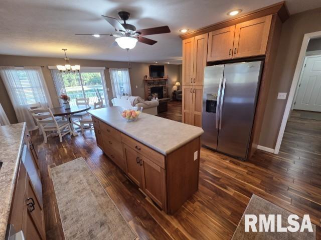 9251 Highway 148 Mount Vernon, IL 62864 - Photo 30 of 68 a kitchen with stainless steel appliances granite countertop a sink a stove and a refrigerator