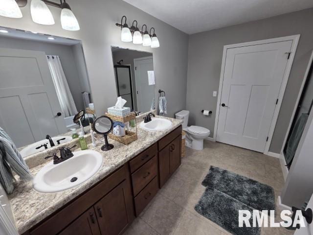 9251 Highway 148 Mount Vernon, IL 62864 - Photo 37 of 68 a bathroom with a double vanity sink and a mirror