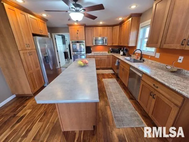 a bedroom with two beds and a flat screen tv