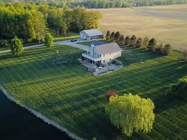 9251 Highway 148 Mount Vernon, IL 62864 - Photo 43 of 68 a front view of a house with a garden and lake view