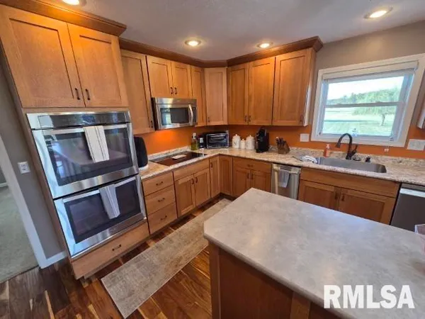 a view of a house with a yard and garage