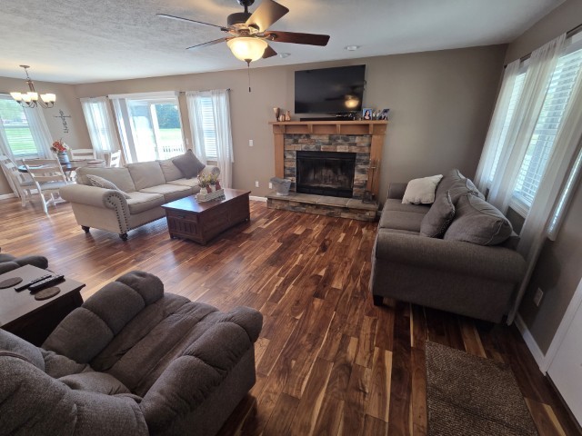 9251 Highway 148 Mount Vernon, IL 62864 - Photo 5 of 68 a living room with furniture and a fireplace