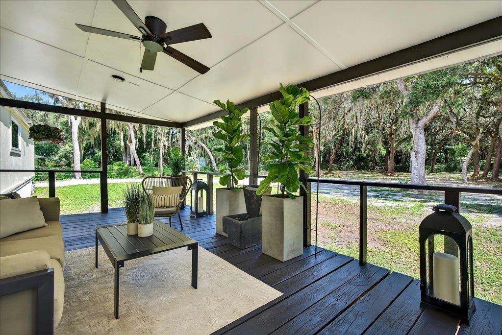 361 Coopers Cove Road St. Augustine, FL 32095 - Photo 1 of 35 a living room with large windows and furniture