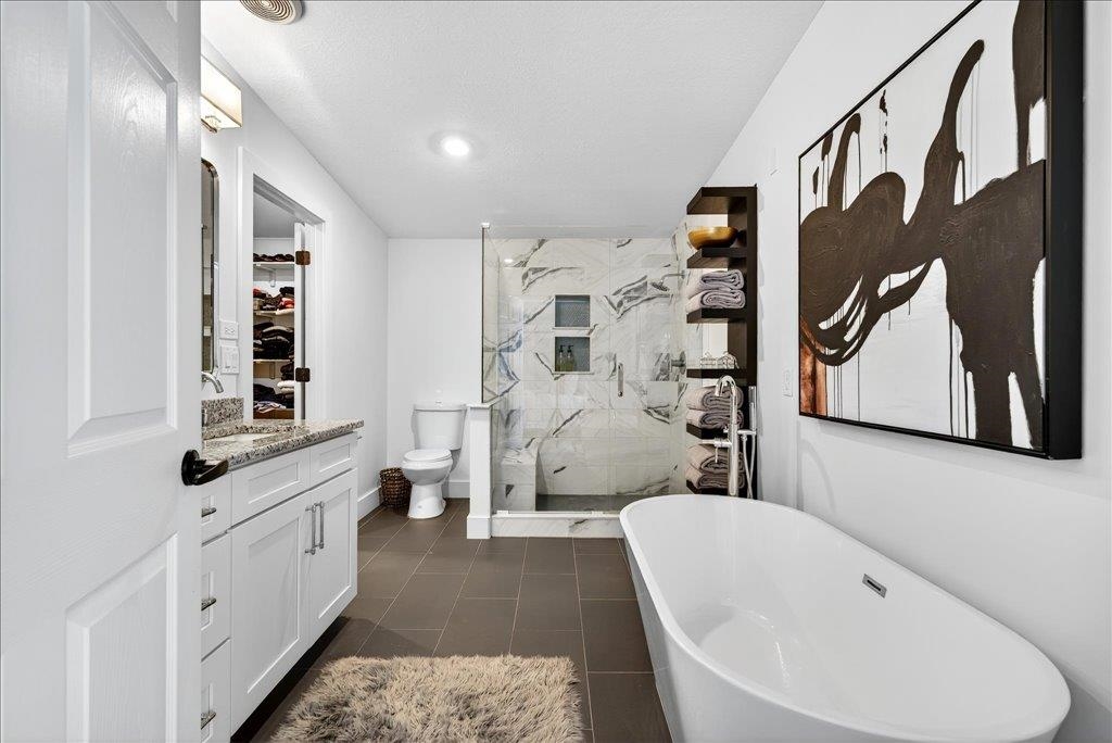 361 Coopers Cove Road St. Augustine, FL 32095 - Photo 21 of 35 a bathroom with a white tub shower and sink