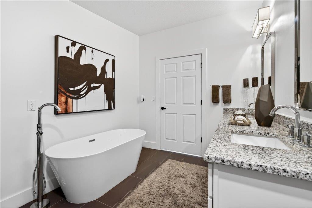 361 Coopers Cove Road St. Augustine, FL 32095 - Photo 22 of 35 a bathroom with a tub and a sink