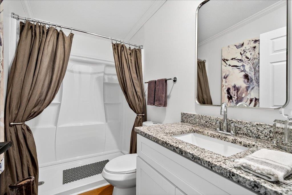 361 Coopers Cove Road St. Augustine, FL 32095 - Photo 25 of 35 a bathroom with a granite countertop sink and a mirror