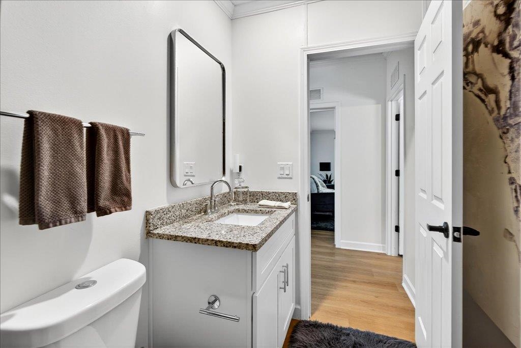 361 Coopers Cove Road St. Augustine, FL 32095 - Photo 26 of 35 a bathroom with a granite countertop sink and a mirror