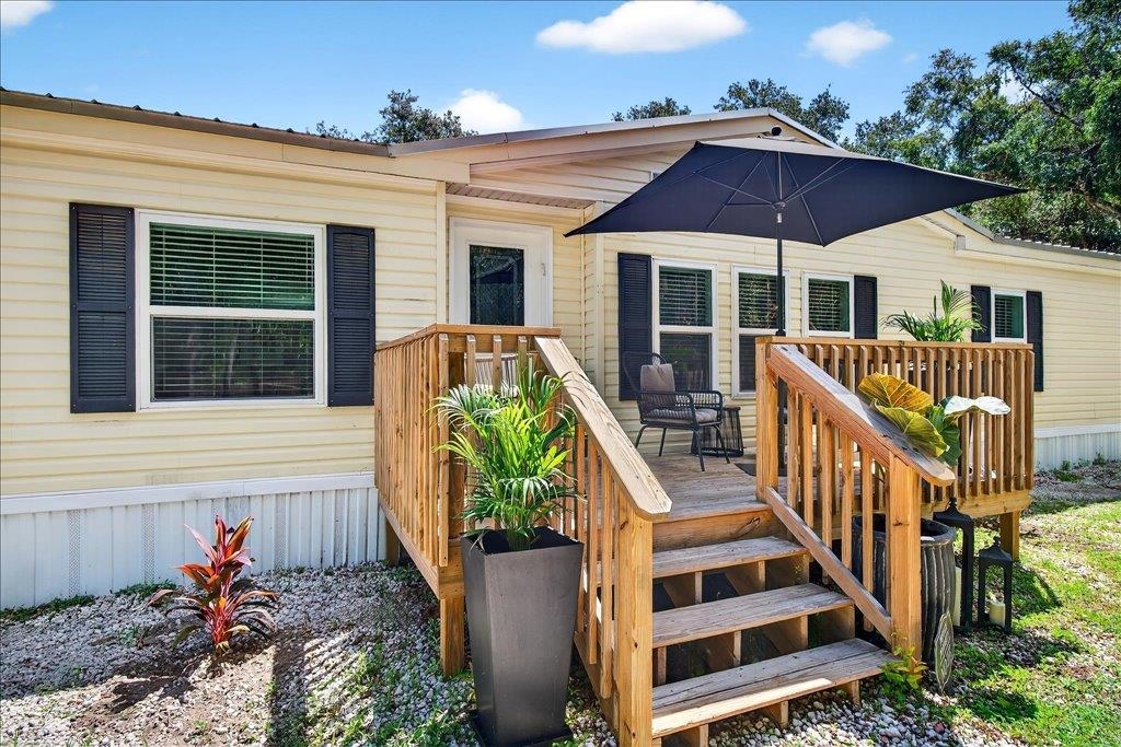 361 Coopers Cove Road St. Augustine, FL 32095 - Photo 35 of 35 a front view of house with deck and outdoor seating