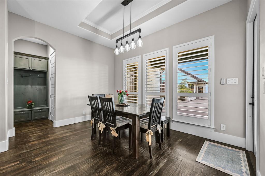 1070 Cornelius Road Rockwall, TX 75087 - Photo 13 of 33 Dining area featuring a tray ceiling and a great view of the backyard