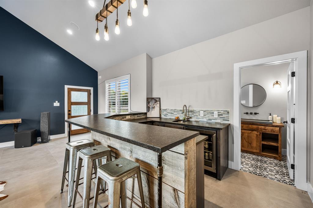 1070 Cornelius Road Rockwall, TX 75087 - Photo 28 of 33 Pool house kitchenette and a peek into the full bathroom