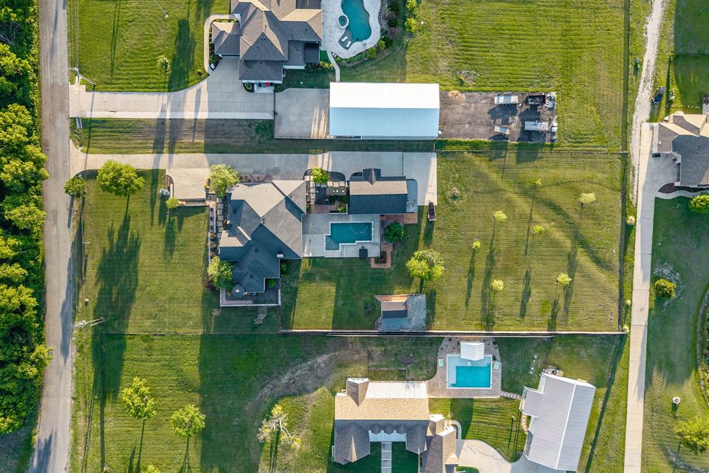 1070 Cornelius Road Rockwall, TX 75087 - Photo 33 of 33 Aerial perspective showcasing a property with a swimming pool and extensive green space