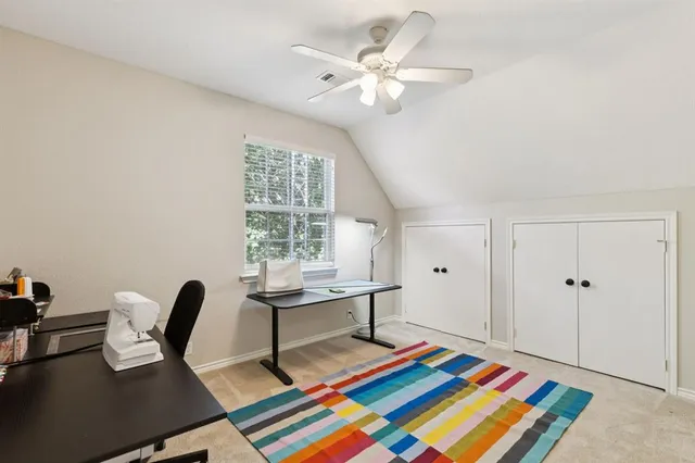 a living room with lots of furniture and kitchen view