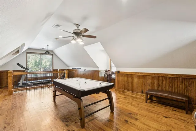 a bedroom with furniture and baby crib