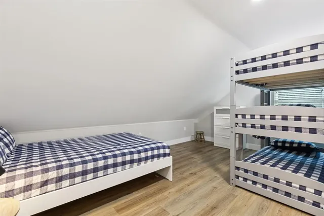 a view of a house with swimming pool and sitting area