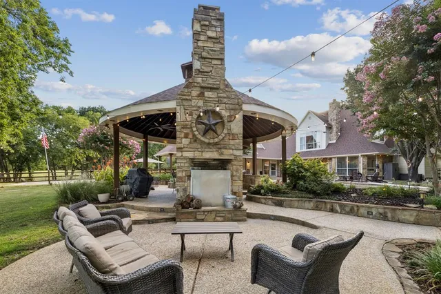 a building outdoor space with patio furniture and potted plants