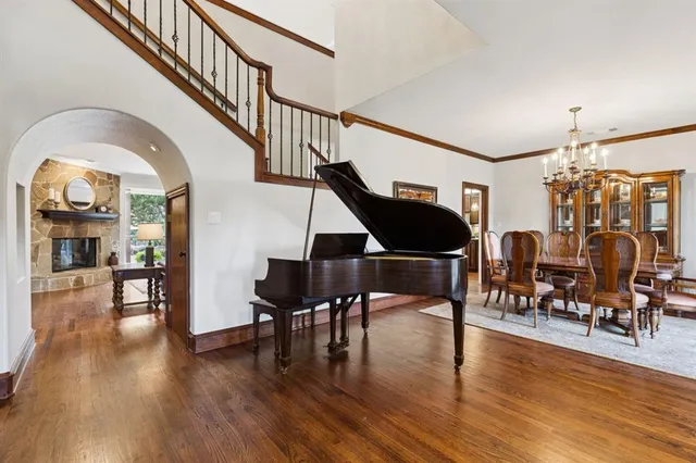 a view of entryway dining room and hall with wooden floor