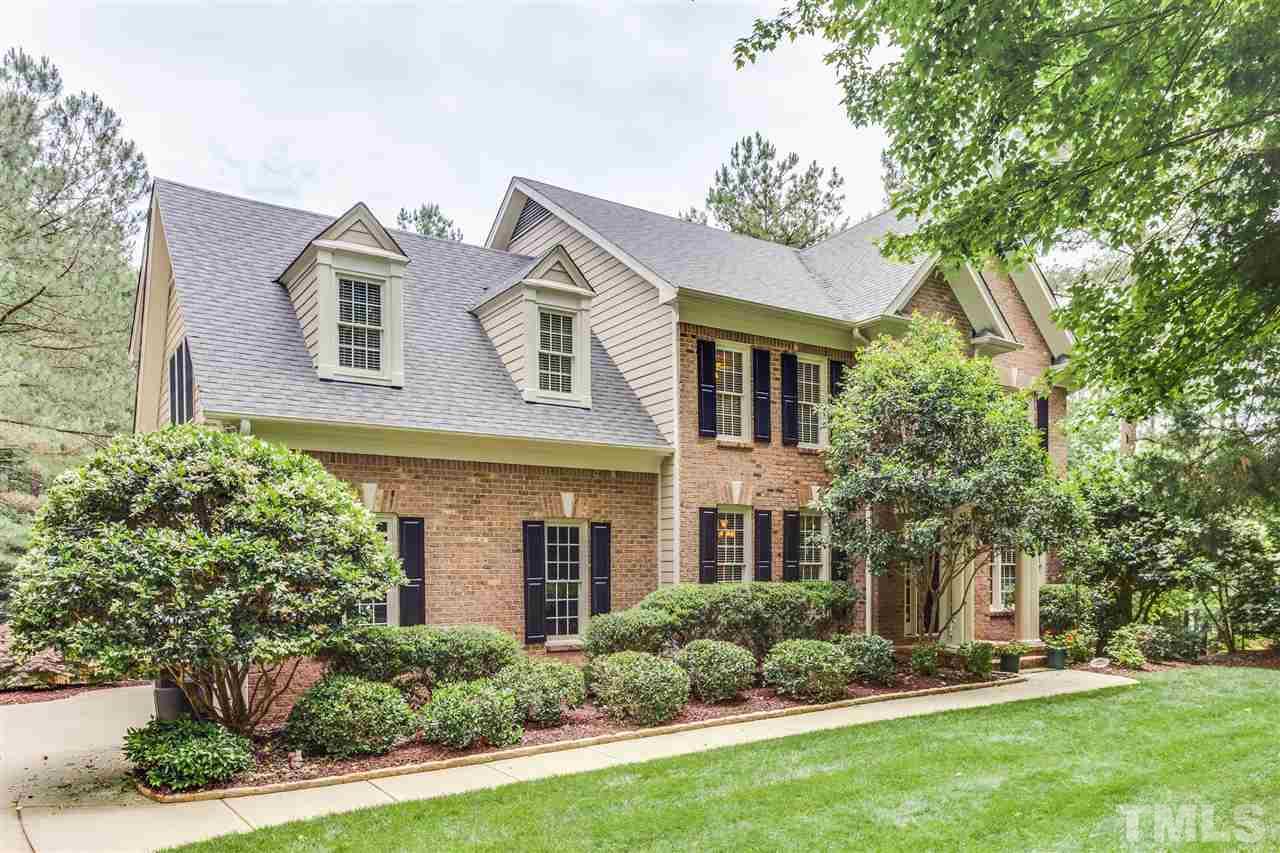 9428 Macon Road Raleigh, NC 27613 - Photo 1 of 25 front view of a house with a yard