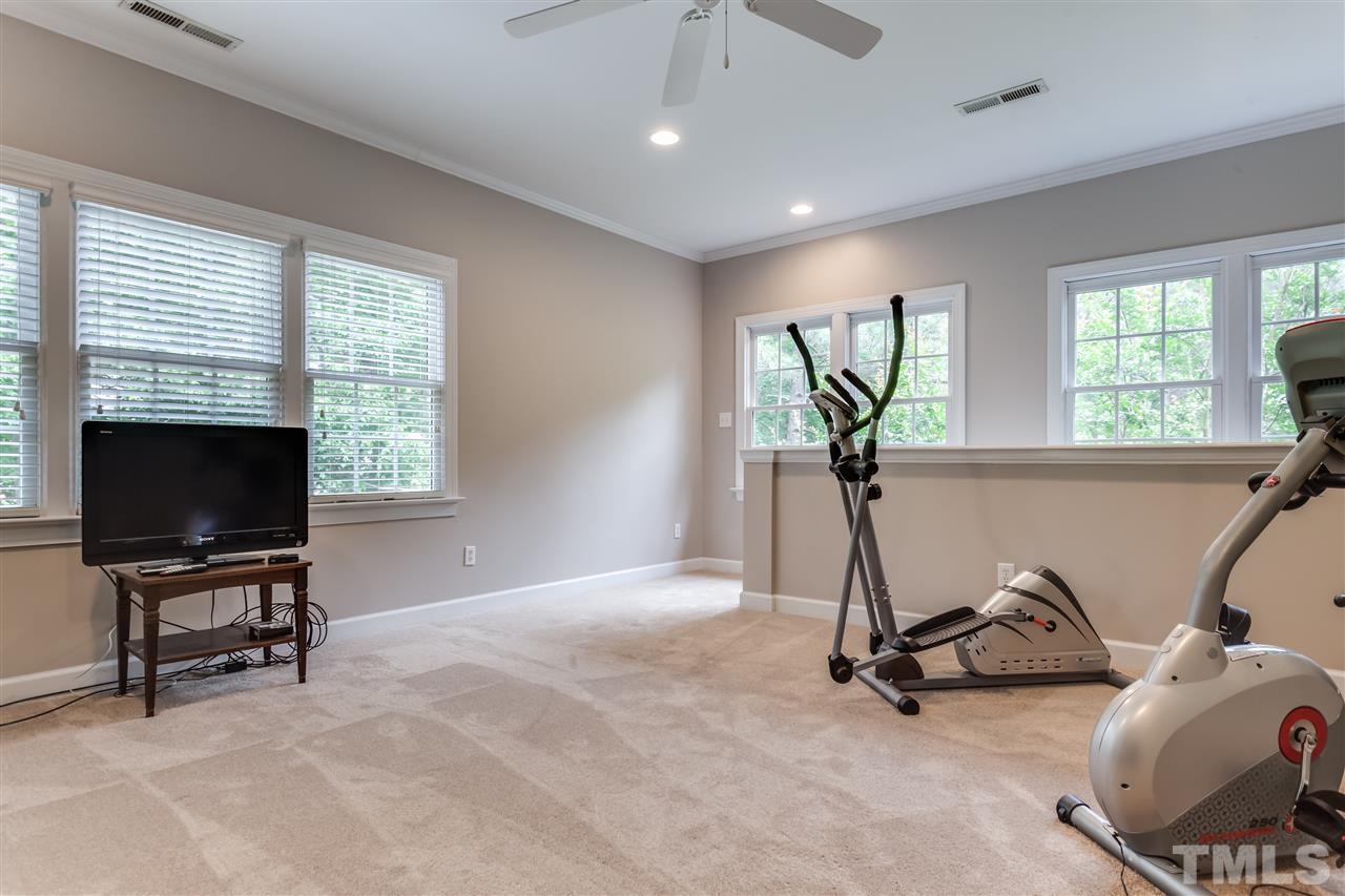 9428 Macon Road Raleigh, NC 27613 - Photo 17 of 25 a view of a livingroom with furniture and a window