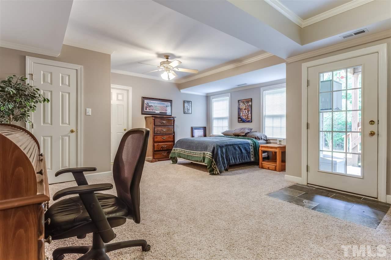 9428 Macon Road Raleigh, NC 27613 - Photo 24 of 25 a bedroom with furniture and a window