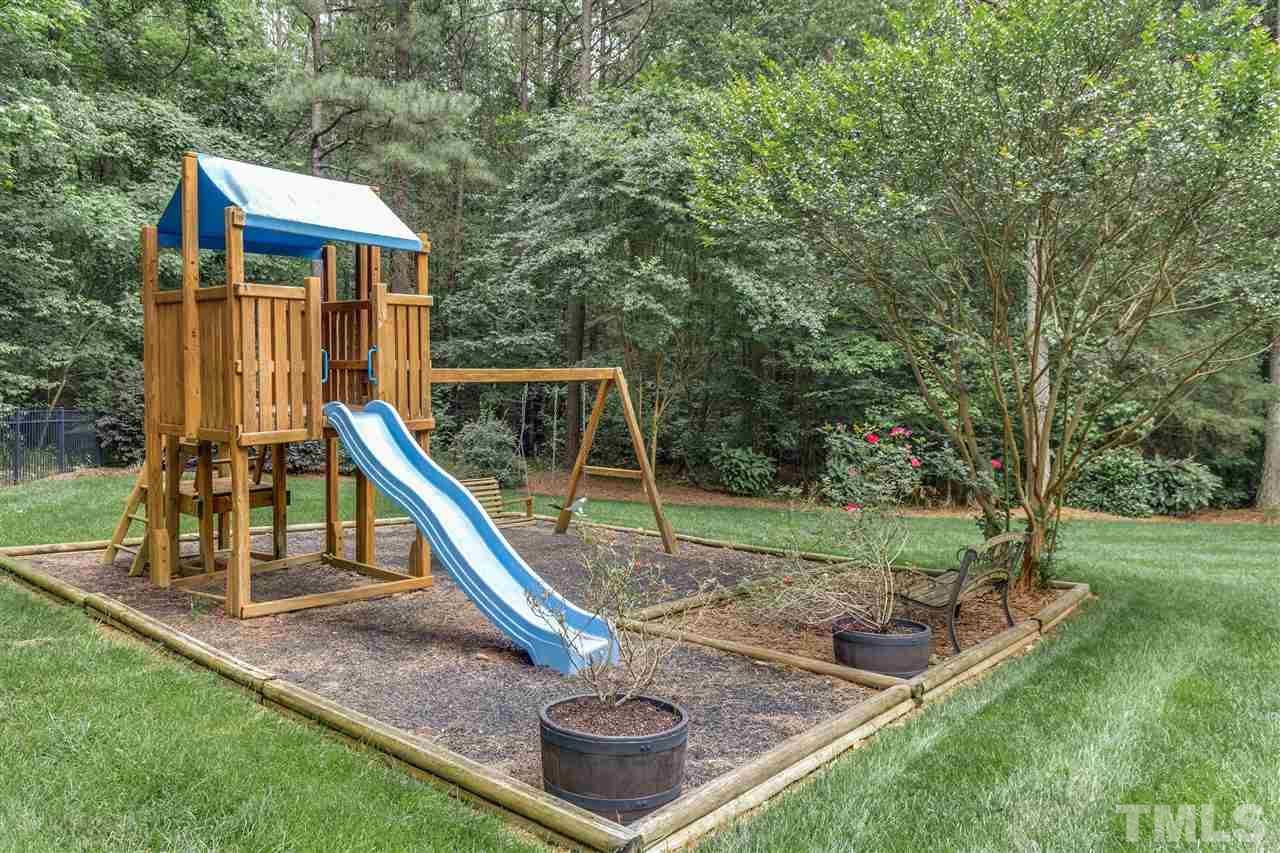 9428 Macon Road Raleigh, NC 27613 - Photo 25 of 25 a view of a house with a park