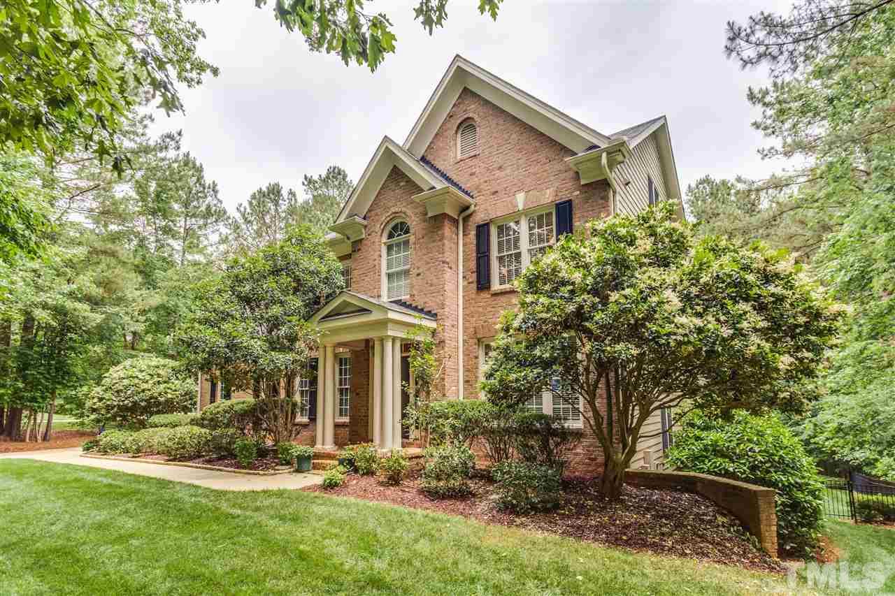 9428 Macon Road Raleigh, NC 27613 - Photo 4 of 25 front view of a house with a yard