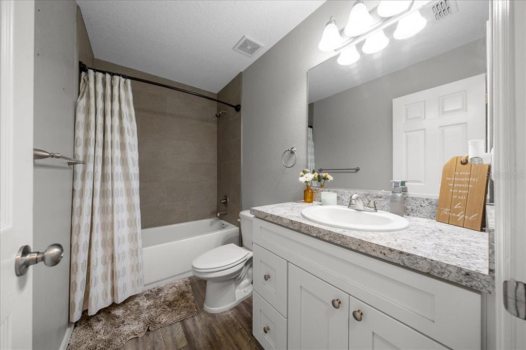 13 Teak Loop Place Ocala, FL 34472 - Photo 26 of 36 a bathroom with a granite countertop sink toilet and shower
