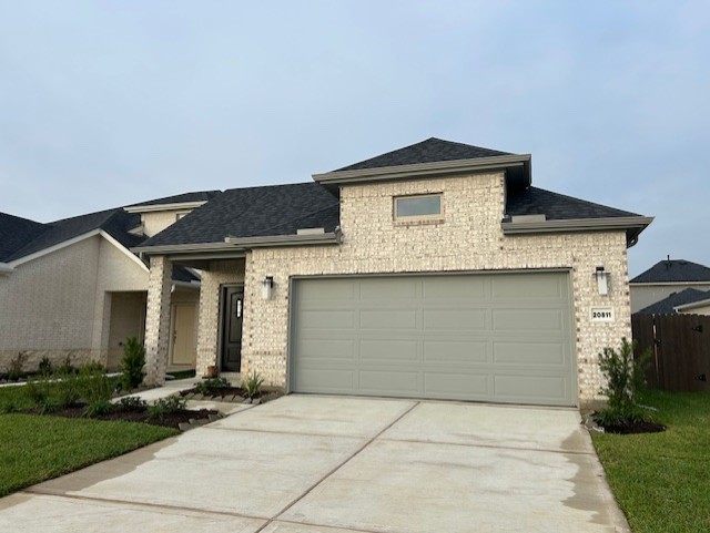 20811 Solaro Summit Trail Tomball, TX 77377 - Photo 1 of 19 a front view of a house with garage
