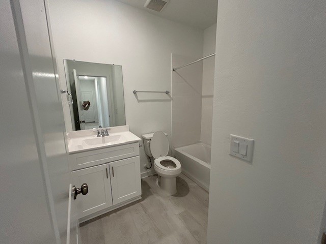 20811 Solaro Summit Trail Tomball, TX 77377 - Photo 11 of 19 a bathroom with a toilet a sink and mirror
