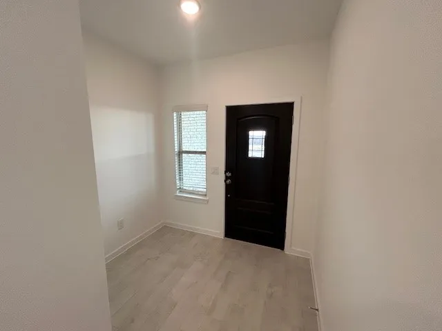 a view of an empty room and window