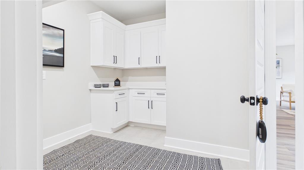 106 Neal Point Atlanta, GA 30349 - Photo 12 of 19 a view of a kitchen with white cabinets and sink