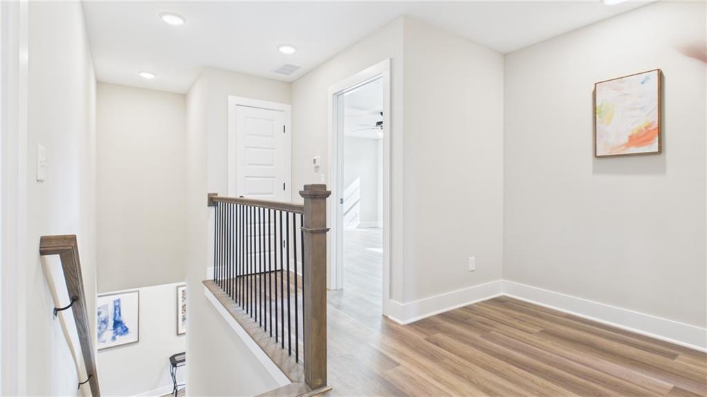 106 Neal Point Atlanta, GA 30349 - Photo 13 of 19 wooden floor in an empty room