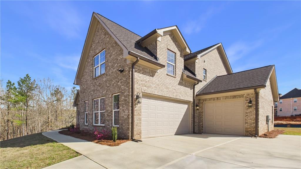106 Neal Point Atlanta, GA 30349 - Photo 18 of 19 a view of a house with a wooden fence
