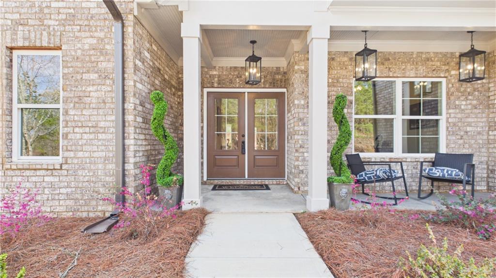 106 Neal Point Atlanta, GA 30349 - Photo 2 of 19 a front view of a house with outdoor seating