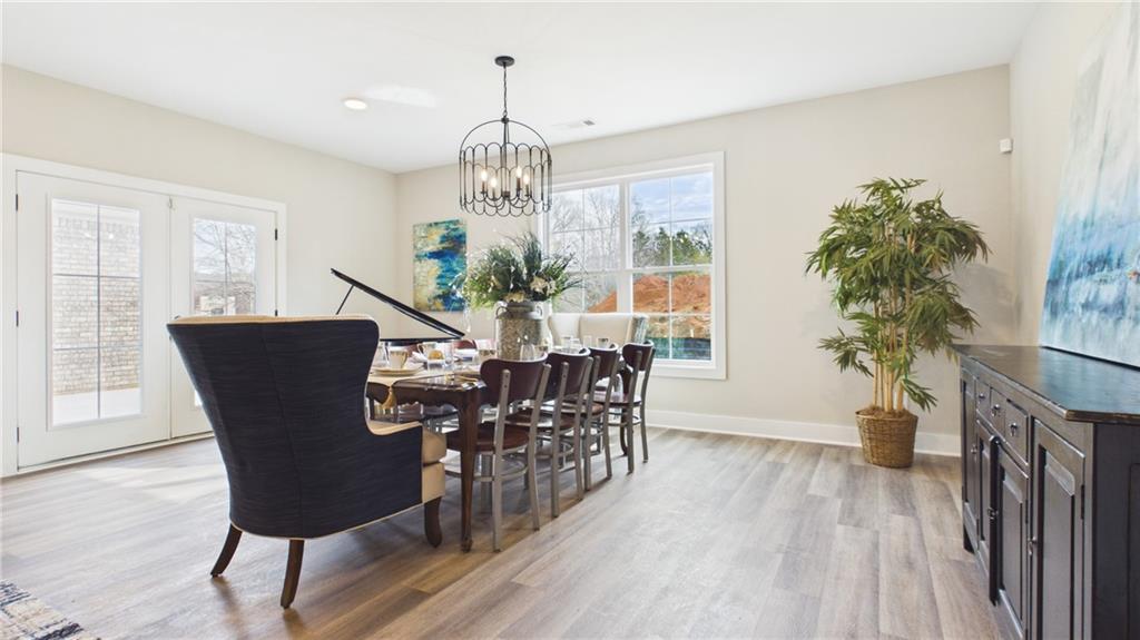 106 Neal Point Atlanta, GA 30349 - Photo 6 of 19 a view of a dining room with furniture window and wooden floor