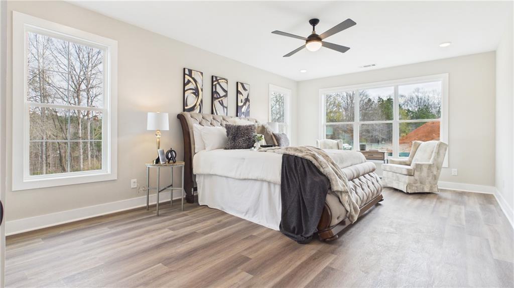 106 Neal Point Atlanta, GA 30349 - Photo 8 of 19 a bed room with a bed and a chair