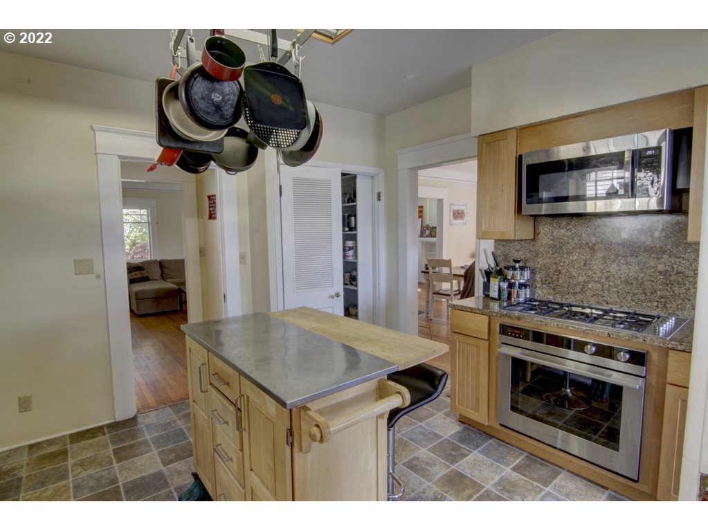 1926 Alder Street Eugene, OR 97405 - Photo 16 of 32 a kitchen with a stove and a microwave