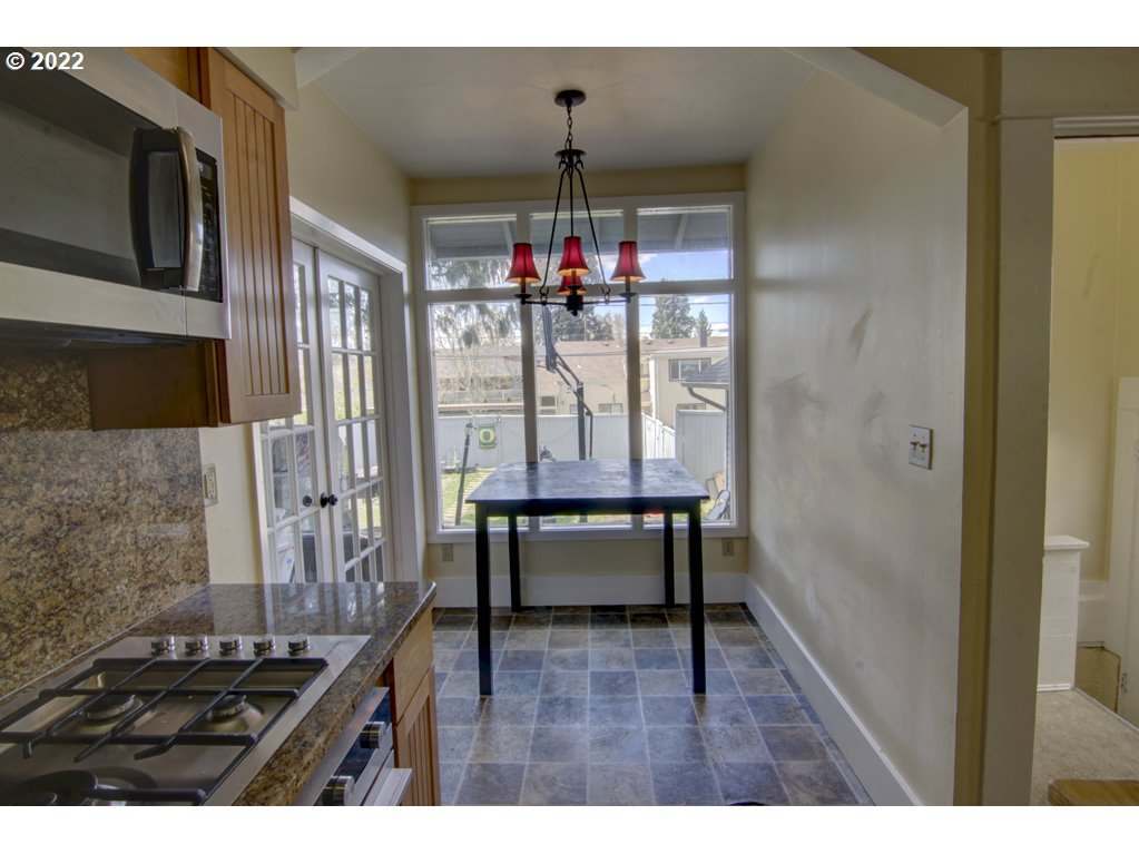 1926 Alder Street Eugene, OR 97405 - Photo 17 of 32 a view of dining room and wooden floor