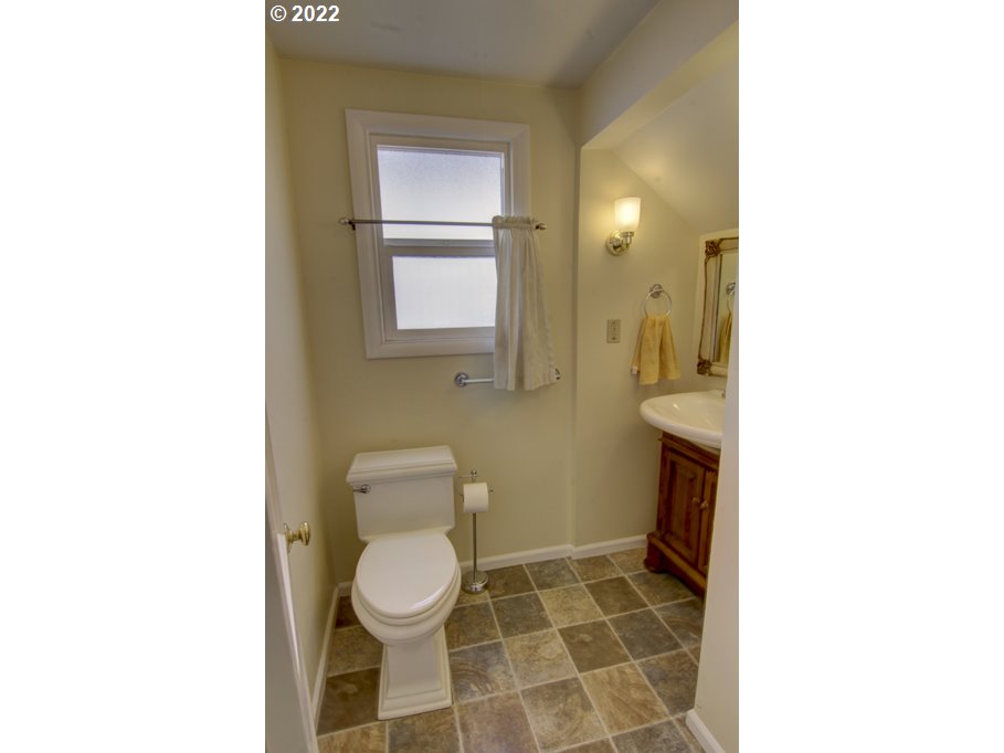 1926 Alder Street Eugene, OR 97405 - Photo 18 of 32 a bathroom with a toilet and a shower
