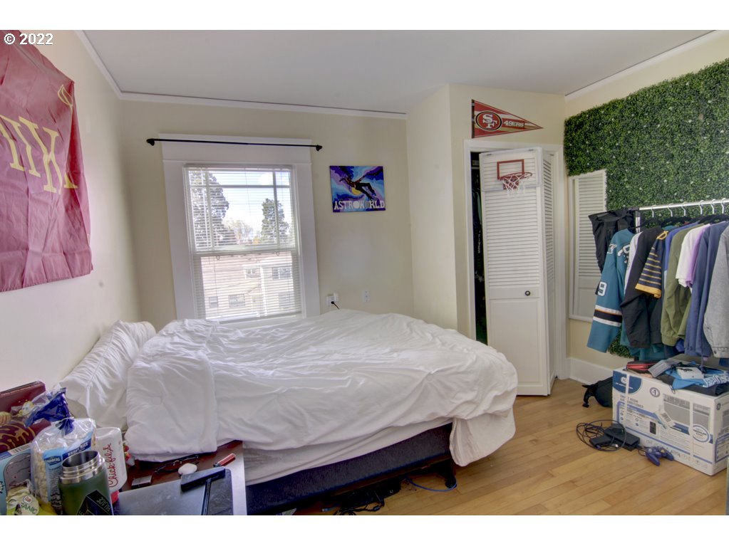 1926 Alder Street Eugene, OR 97405 - Photo 23 of 32 a bedroom with a bed and a flat screen tv