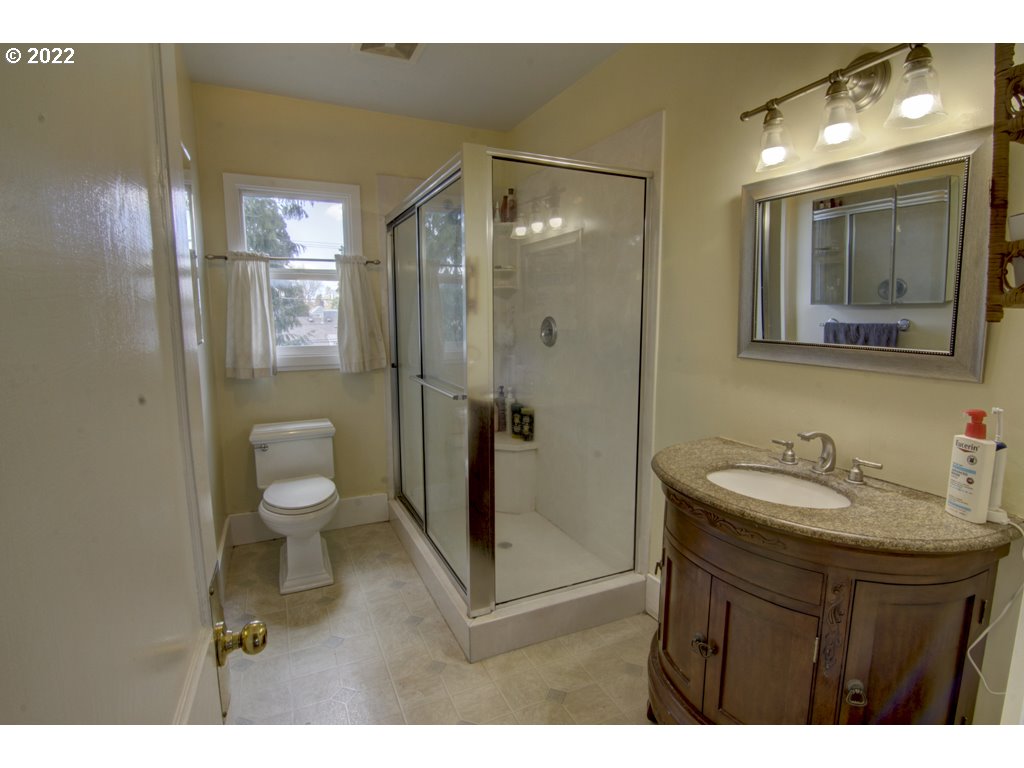 1926 Alder Street Eugene, OR 97405 - Photo 24 of 32 a bathroom with a sink and a mirror