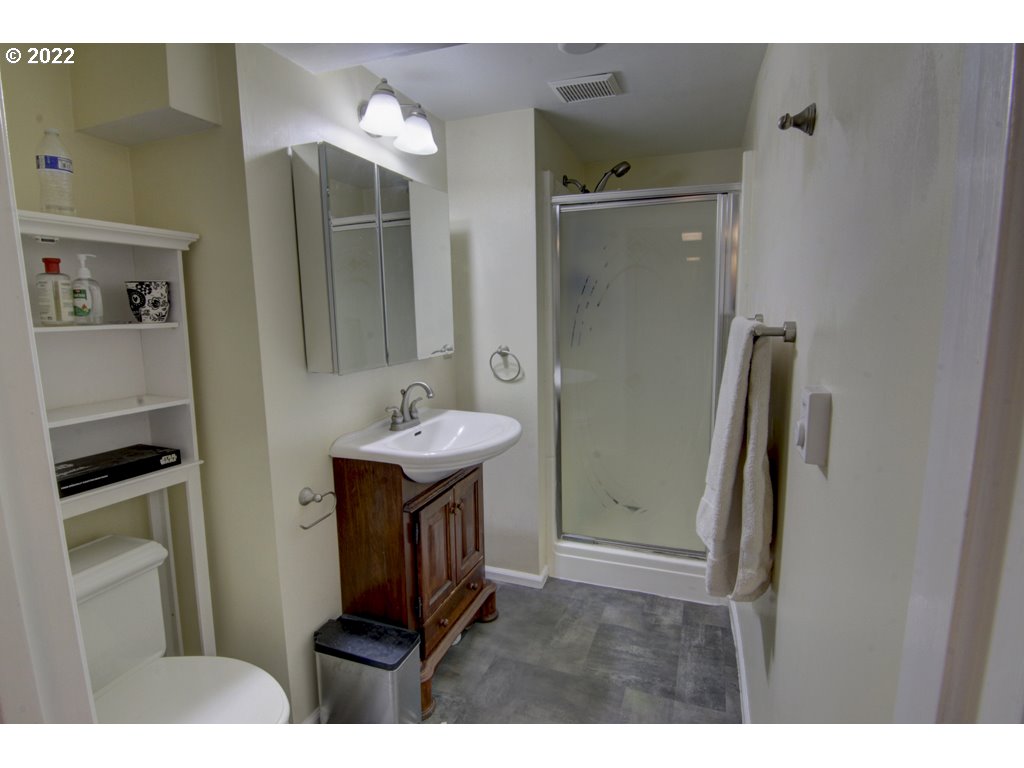 1926 Alder Street Eugene, OR 97405 - Photo 27 of 32 a bathroom with a sink and a mirror