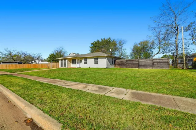 a view of a house with a big yard