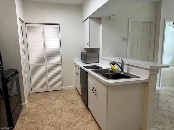 a kitchen that has a sink and a stove